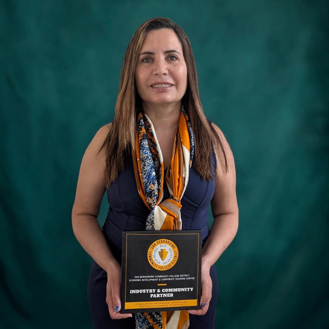 Diala Jawhary with the Industry & Community Partner plaque at EDCT's 25th Anniversary Celebration